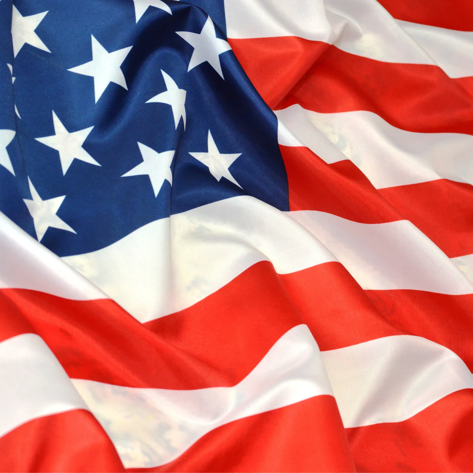 Close-up of the United States flag waving in the wind.