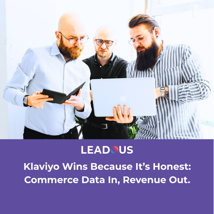 Marketing team reviewing commerce data and lifecycle campaign performance on a laptop, representing Klaviyo’s ability to turn transaction data into revenue-driving messaging.